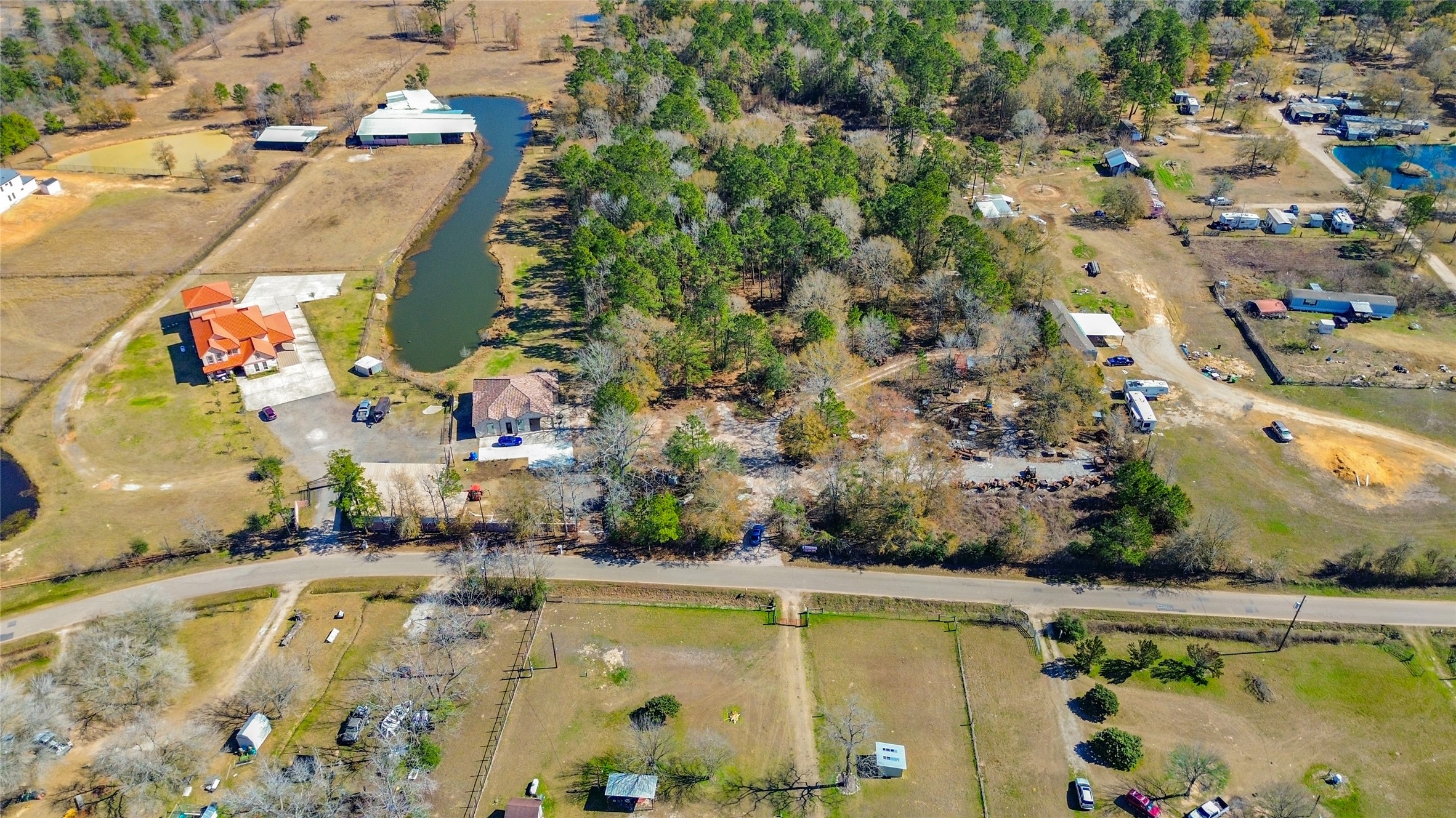 14187 Tommy Smith Road Conroe, TX 77306 - Photo 3 of 8 an aerial view of residential houses with outdoor space and swimming pool