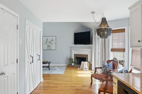 a living room with furniture fireplace and flat screen tv