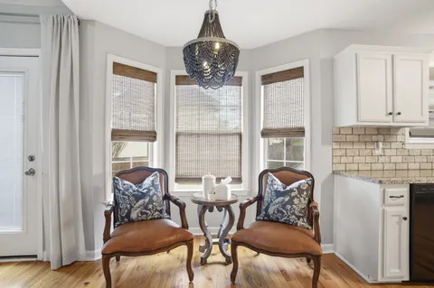 a dining room with furniture and window