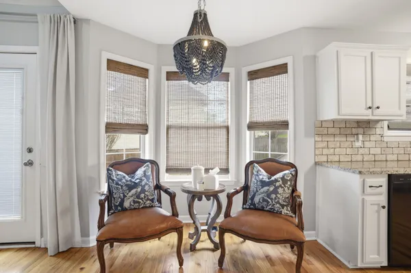 a dining room with furniture and window