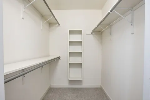 a view of an empty walk in closet