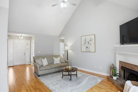 a living room with furniture and a fireplace