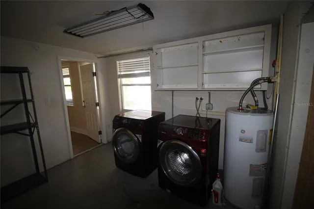 a utility room with dryer and washer