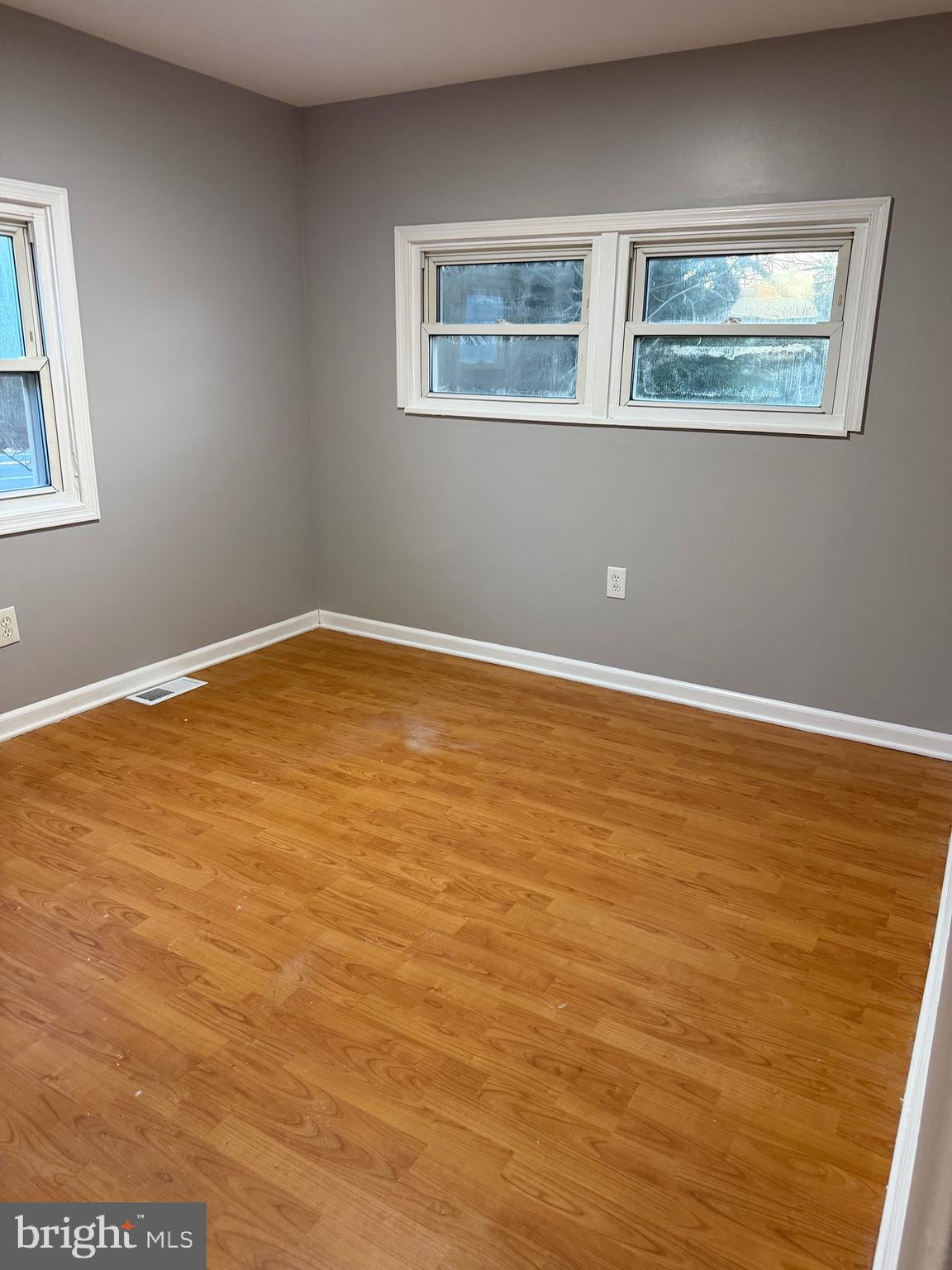 3018 Philadelphia Road Abingdon, MD 21009 - Photo 11 of 20 a view of an empty room with wooden floor and a window