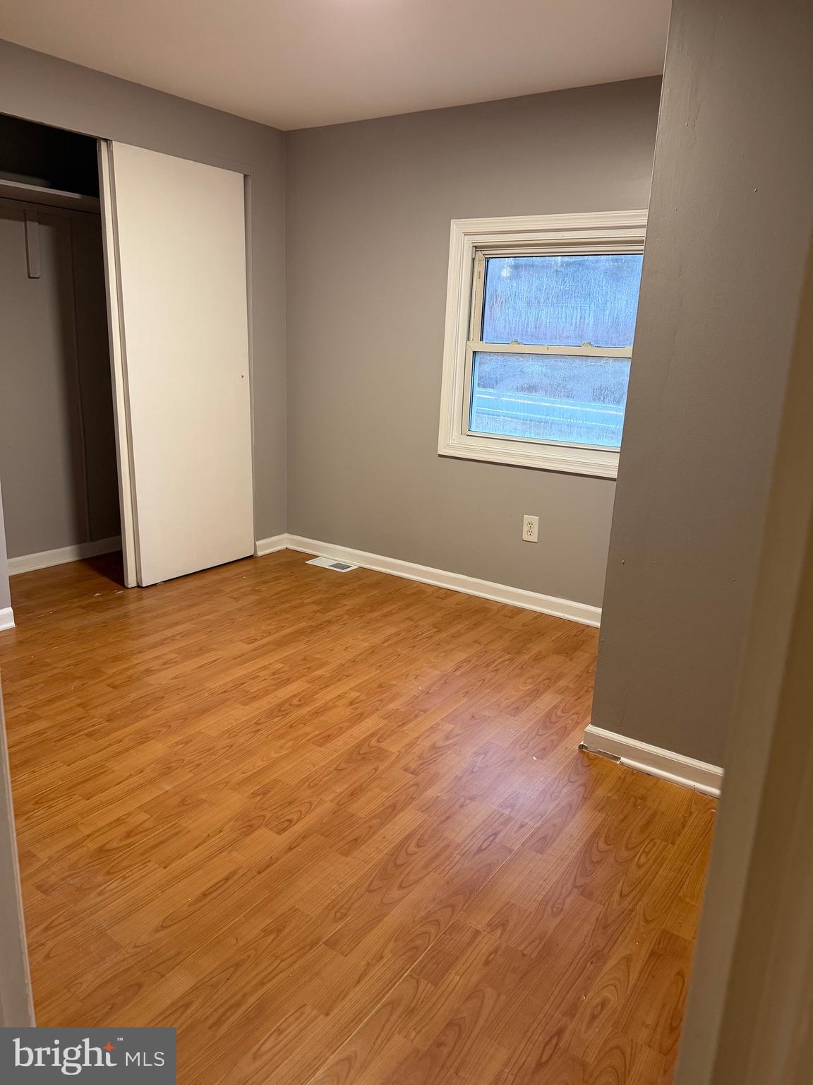 3018 Philadelphia Road Abingdon, MD 21009 - Photo 13 of 20 an empty room with wooden floor and windows