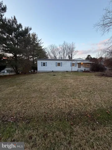 a view of a big yard with a house