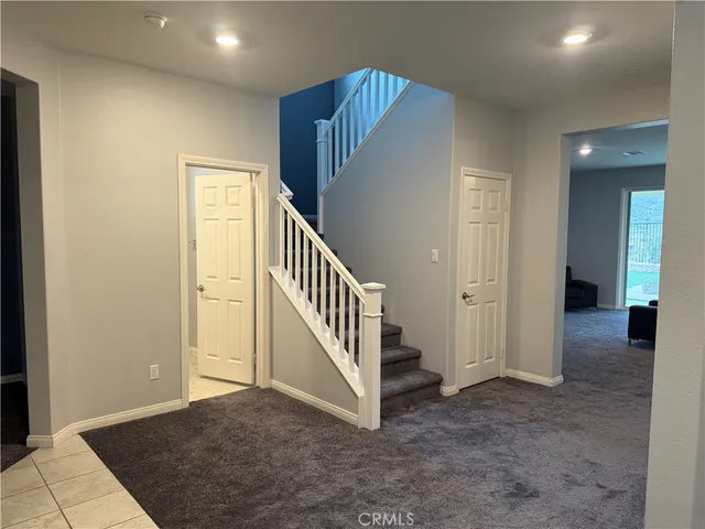 a view of a hallway with staircase