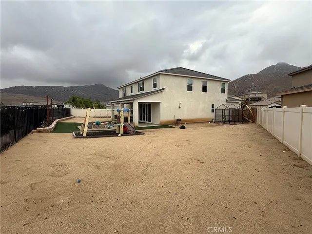 a big house with a large tree in front of it