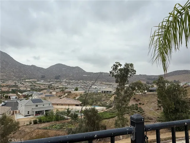an aerial view of residential house and car parked