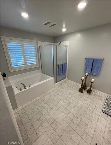 a room with a bed and a chair