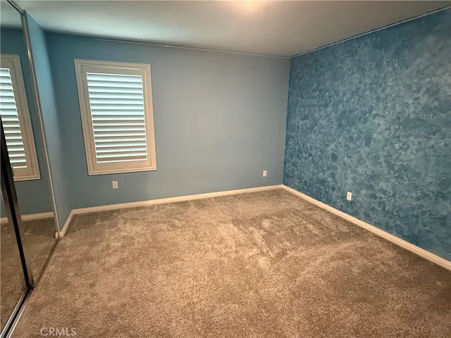 a view of empty room with windows