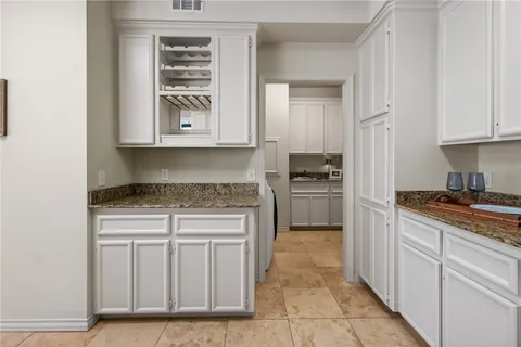 a bedroom with a bed ceiling fan and a window
