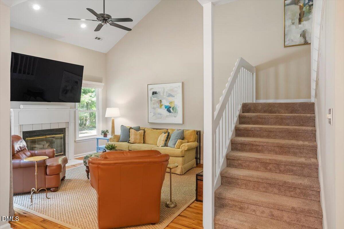 8321 Hempshire Place, Unit 103 Raleigh, NC 27613 - Photo 4 of 25 a living room with furniture and a fireplace