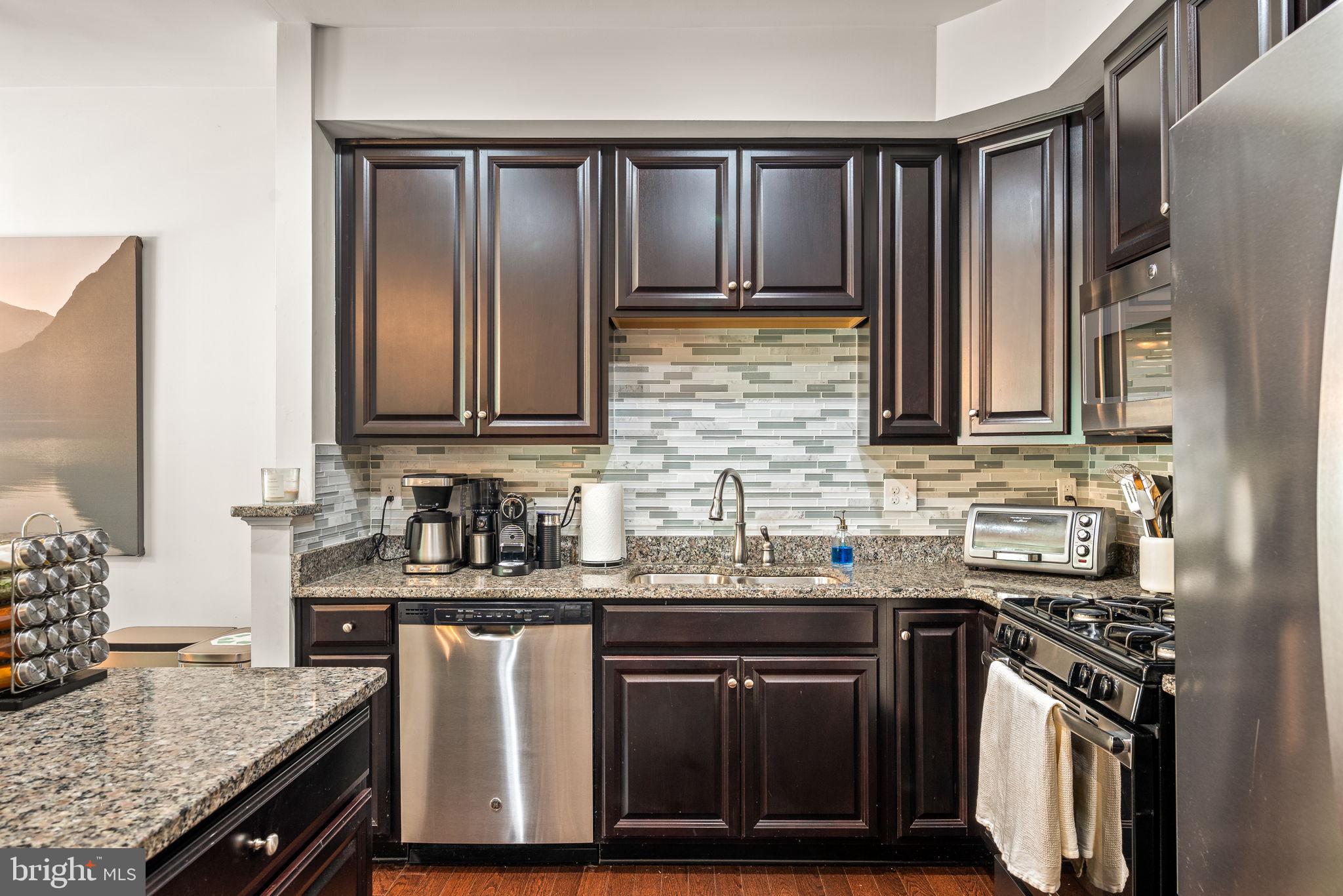 804 Sisler Road Phoenixville, PA 19460 - Photo 12 of 36 Kitchen with granite tops and tile backsplash