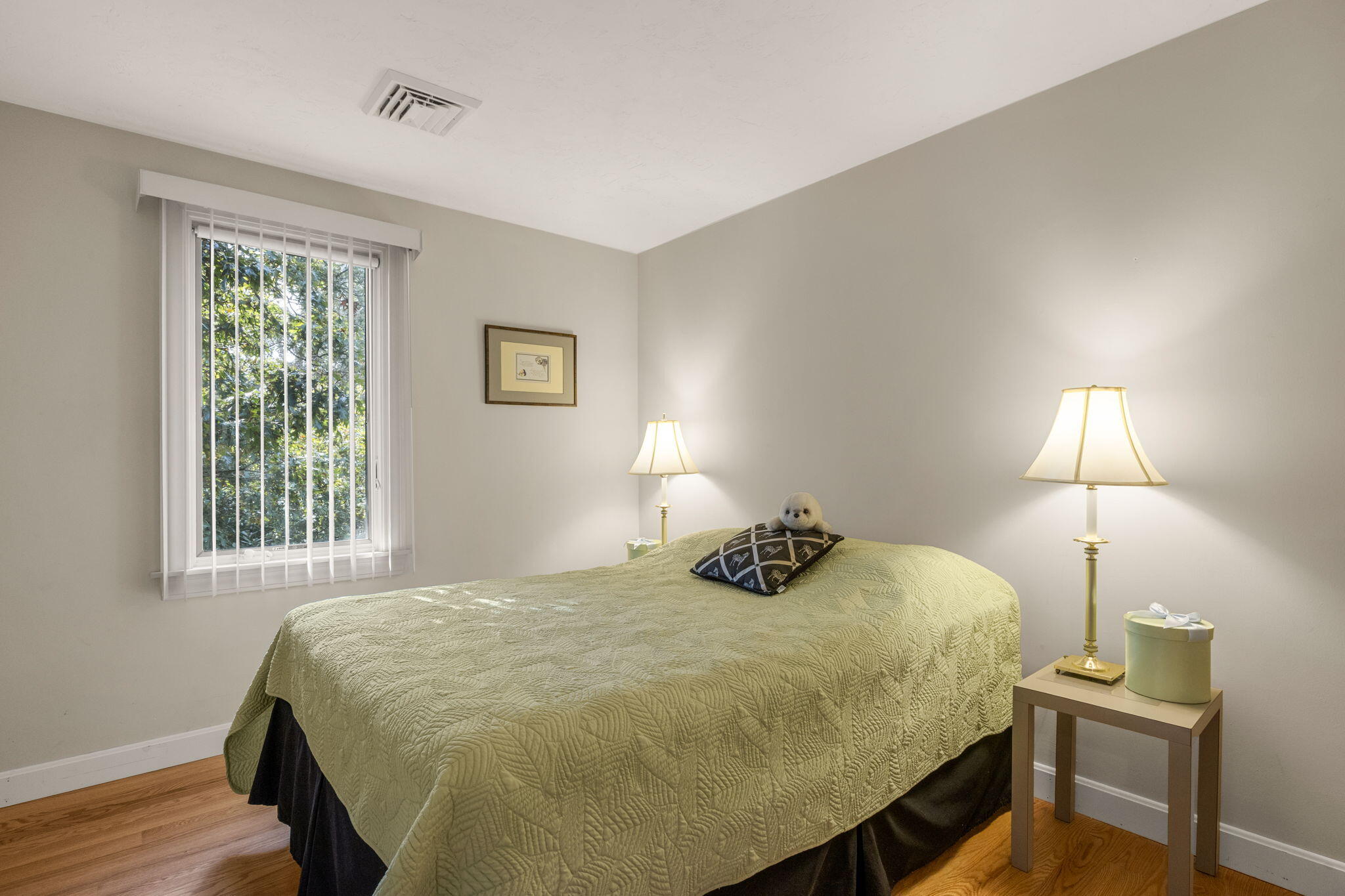 32 Walton Road Harwich, MA 02645 - Photo 20 of 42 a bedroom with a bed and a lamp
