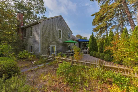 a view of balcony with furniture and wooden deck