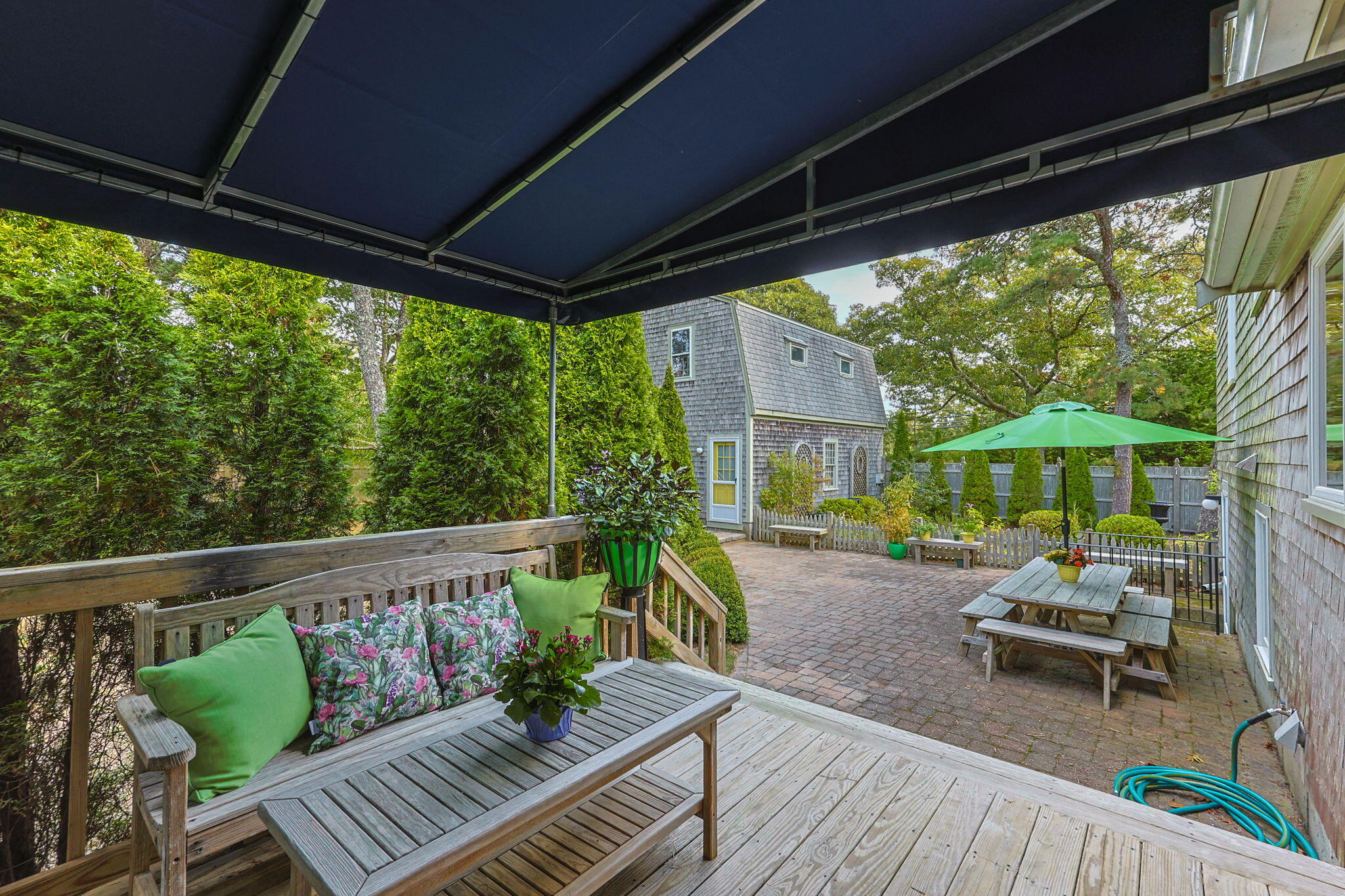32 Walton Road Harwich, MA 02645 - Photo 31 of 42 a view of a chairs and table in patio with a small yard