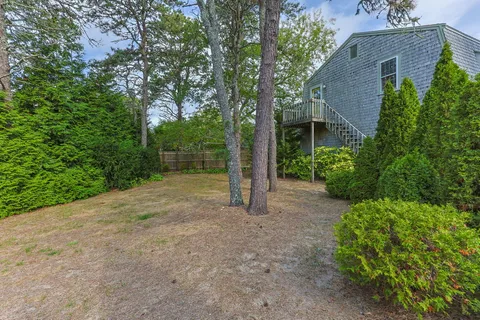 an aerial view of a house with a yard and garden