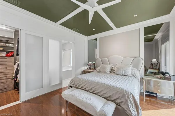 a bedroom with a bed and a walk in closet