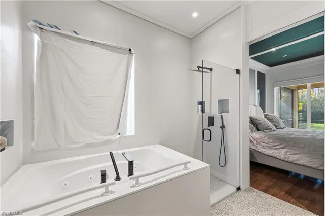 a en suite bathroom with a tub and shower