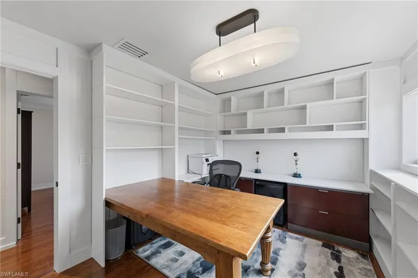 a room with a cabinets and wooden floor