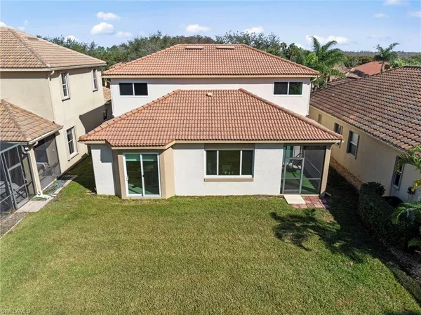 a view of a house with a yard