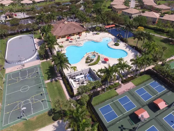 an aerial view of residential house with outdoor space and swimming pool