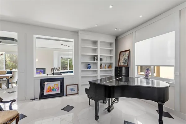 a workspace with furniture and a bookshelf