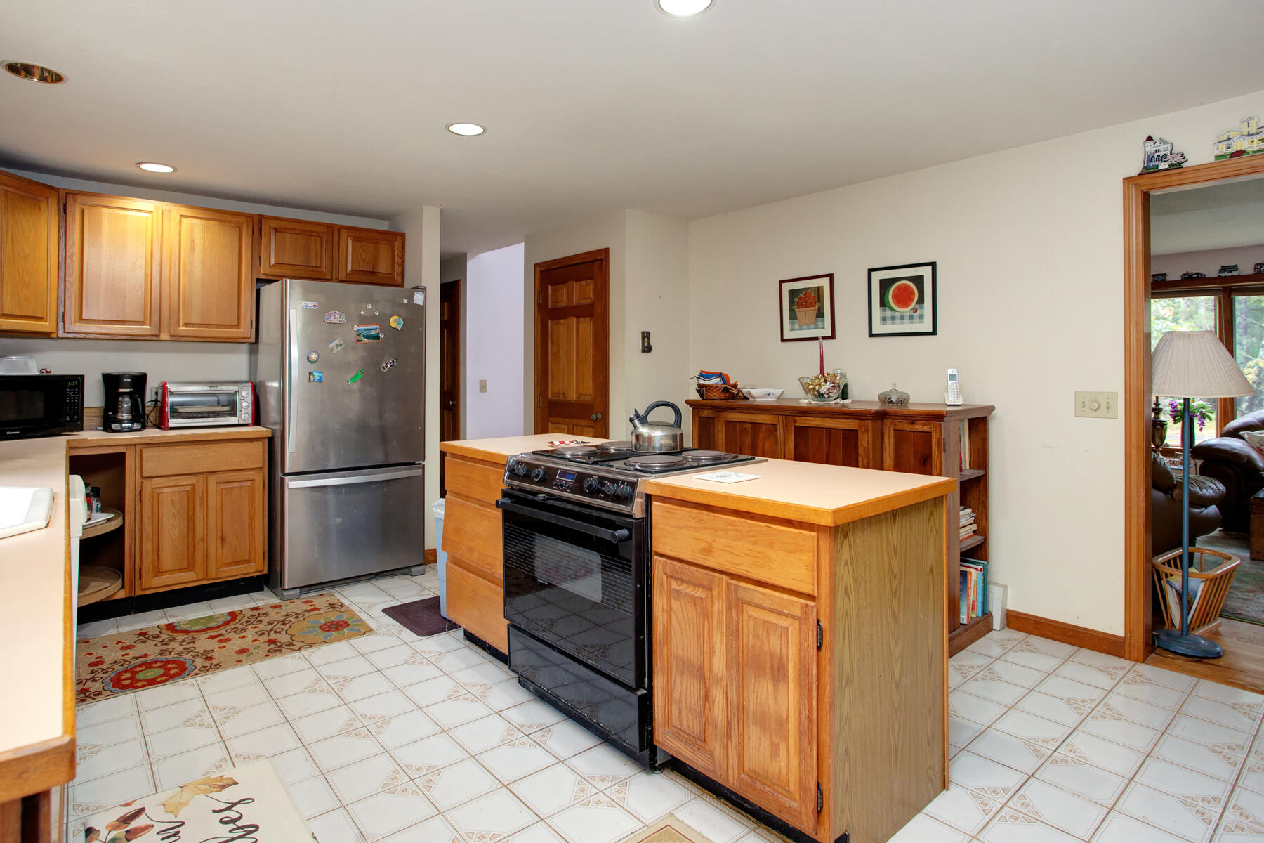 62 Pine Ridge Road Cotuit, MA 02635 - Photo 7 of 31 a kitchen with stainless steel appliances granite countertop a stove a refrigerator and a cabinets