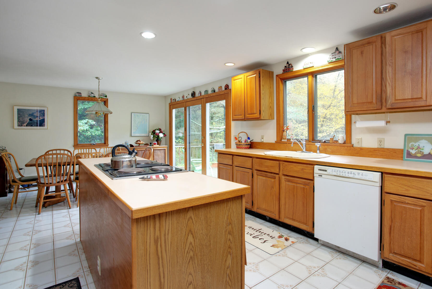 62 Pine Ridge Road Cotuit, MA 02635 - Photo 9 of 31 a kitchen with stainless steel appliances granite countertop a sink a stove and a refrigerator
