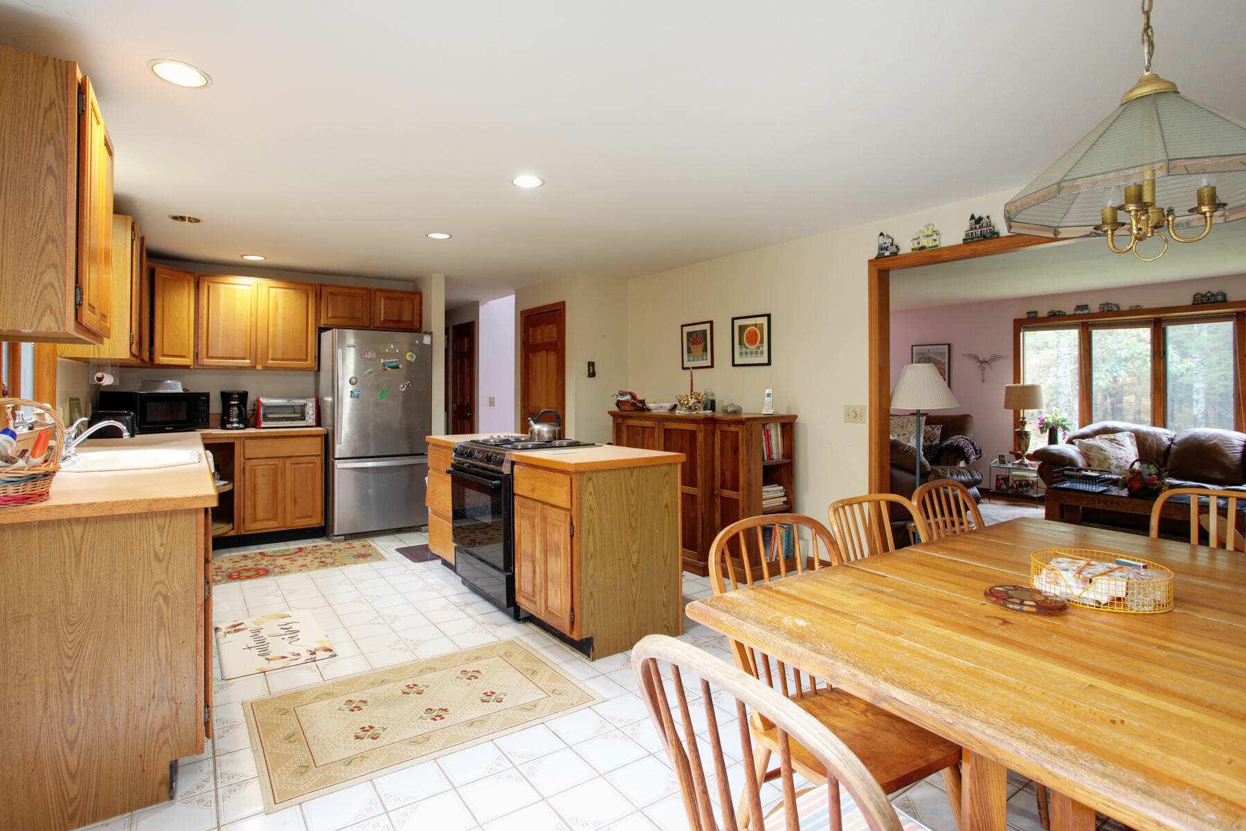 62 Pine Ridge Road Cotuit, MA 02635 - Photo 10 of 31 a very nice looking open dining room with kitchen island