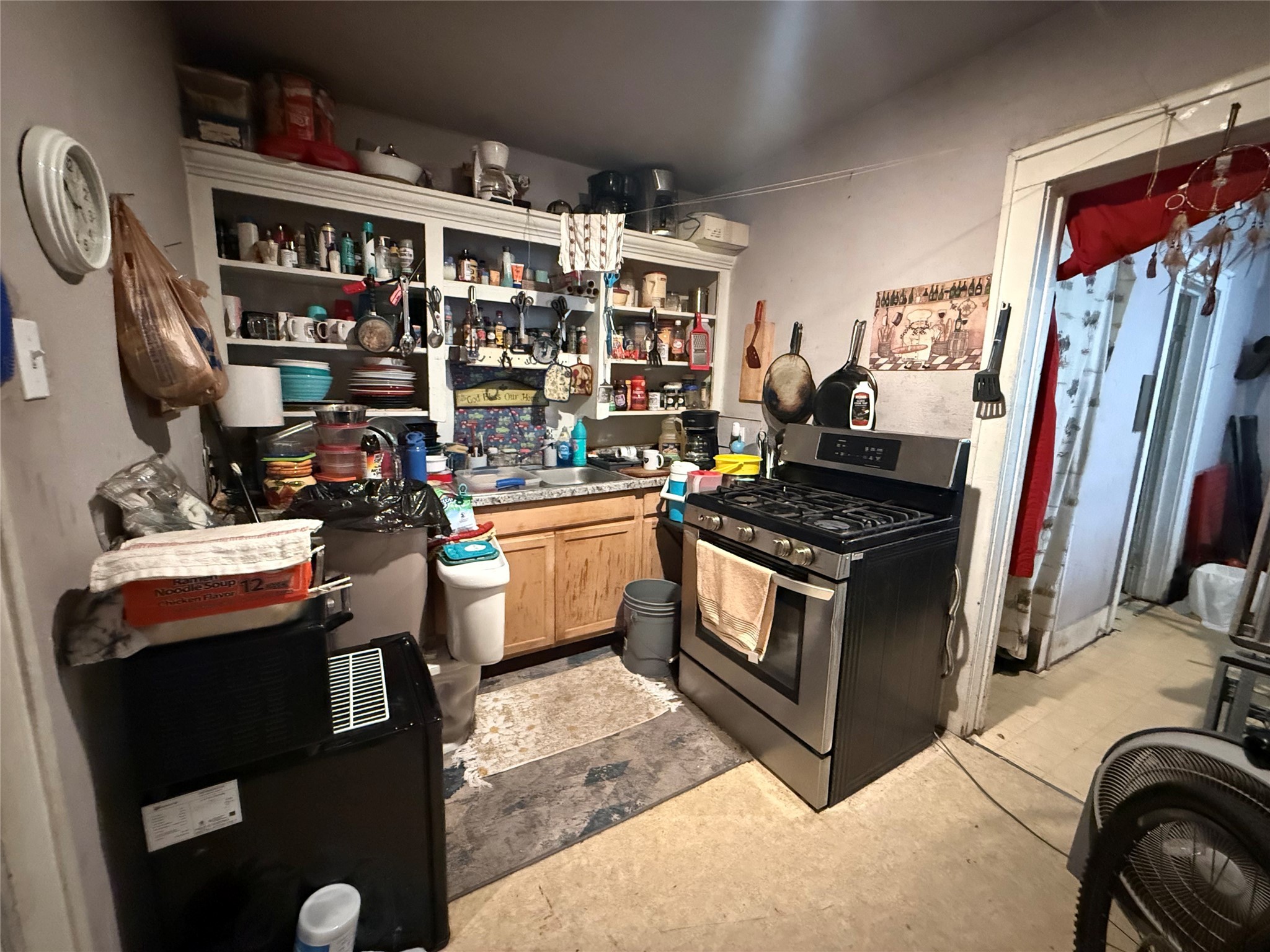 1109 North 67th Street Houston, TX 77011 - Photo 17 of 22 a kitchen with stainless steel appliances granite countertop a stove and a sink