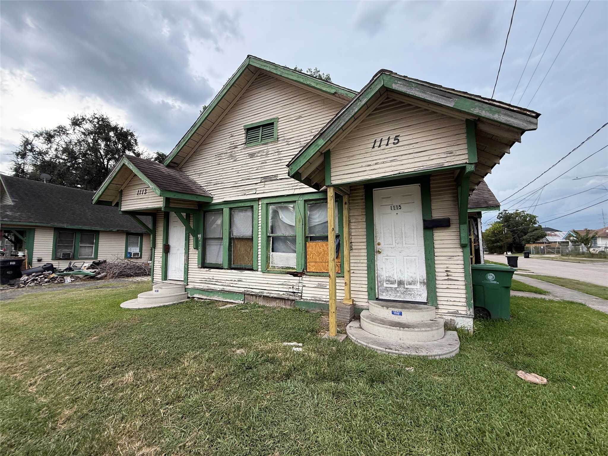 1109 North 67th Street Houston, TX 77011 - Photo 4 of 22 a front view of a house with a yard table and chairs