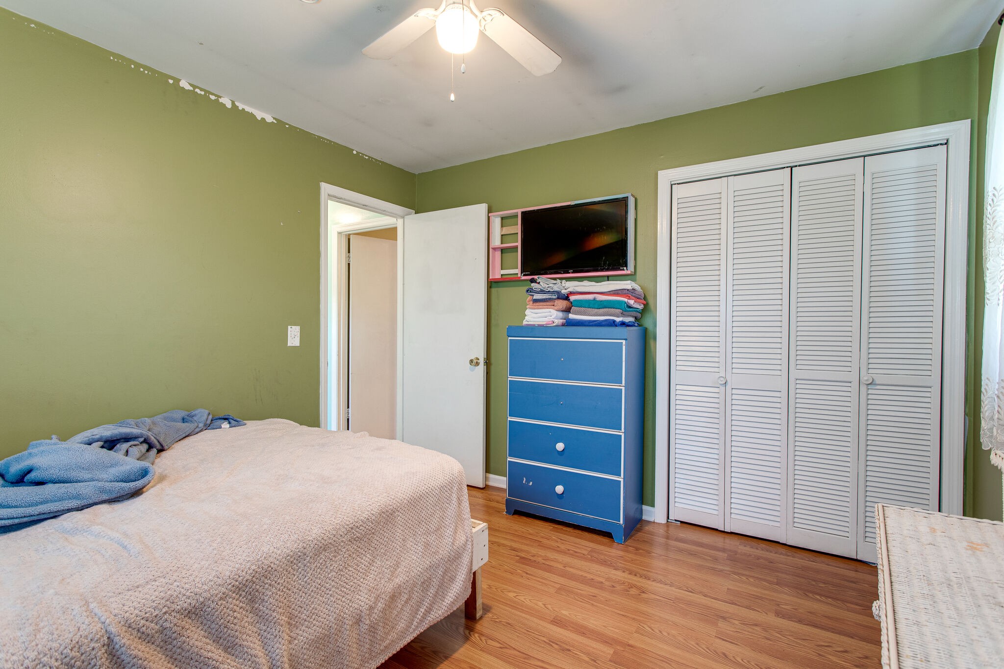 116 Tusculum Road Antioch, TN 37013 - Photo 13 of 27 a bedroom with a bed and flat screen tv