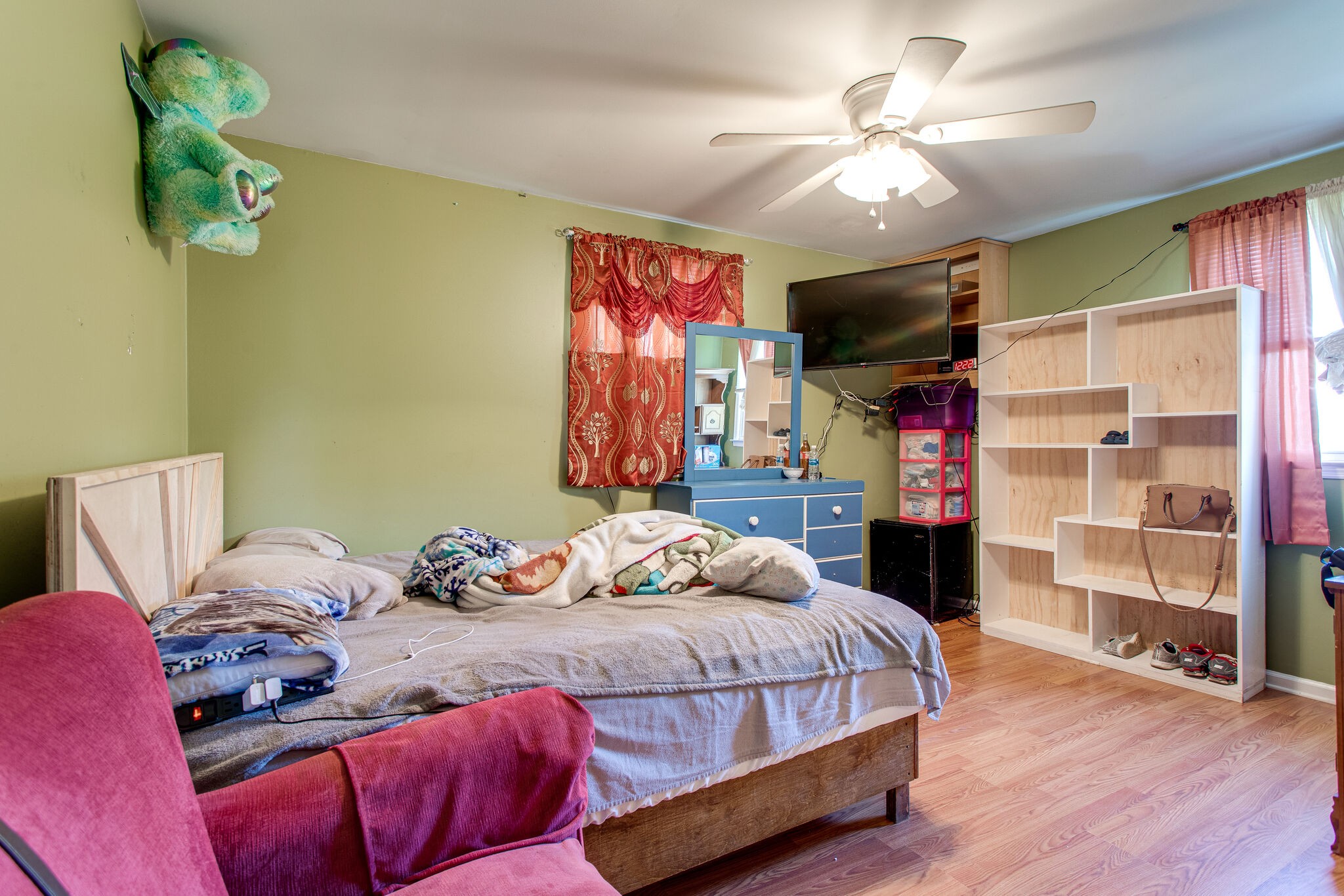 116 Tusculum Road Antioch, TN 37013 - Photo 15 of 27 a bedroom with a bed and a chandelier
