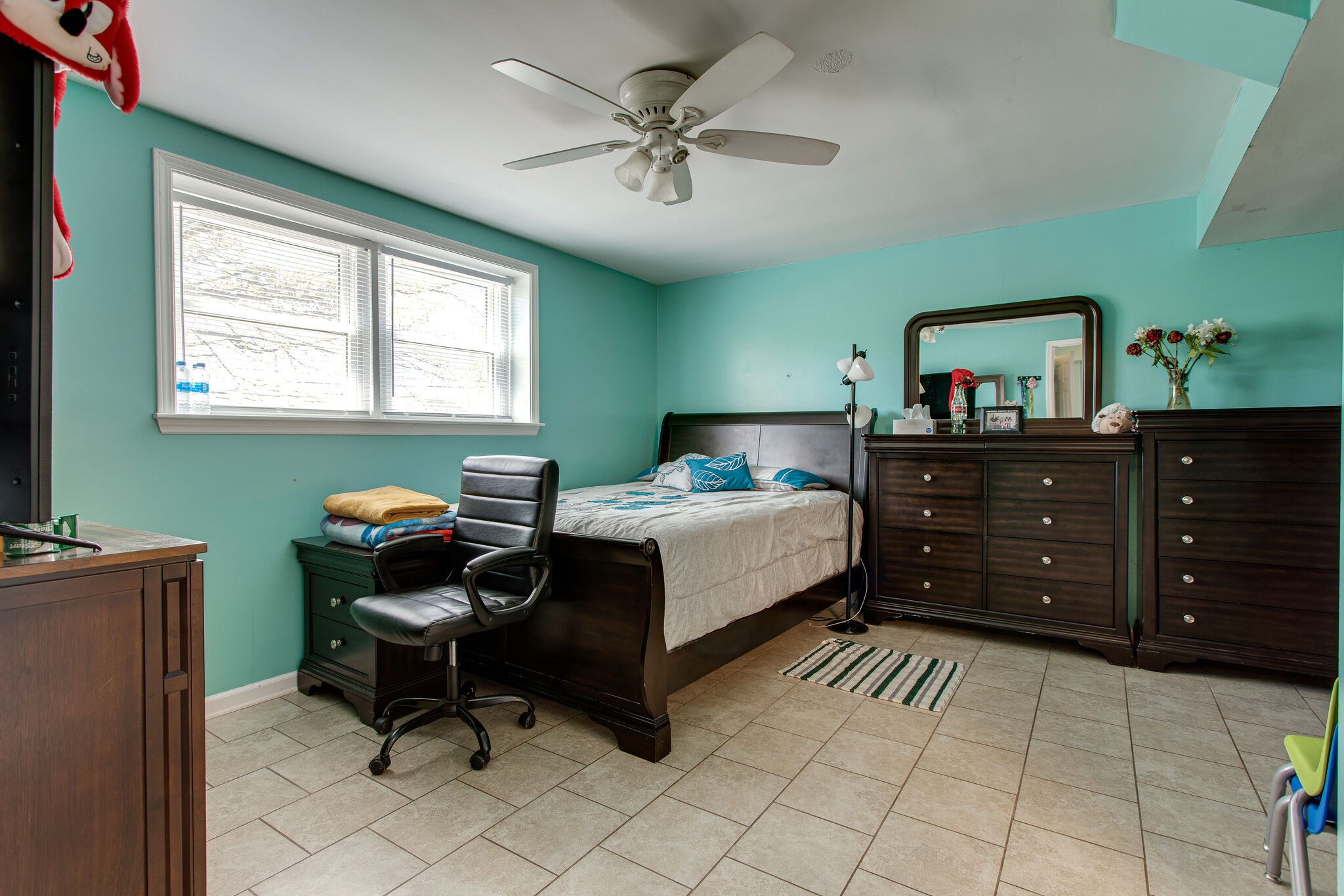116 Tusculum Road Antioch, TN 37013 - Photo 17 of 27 a bedroom with a bed and a chandelier