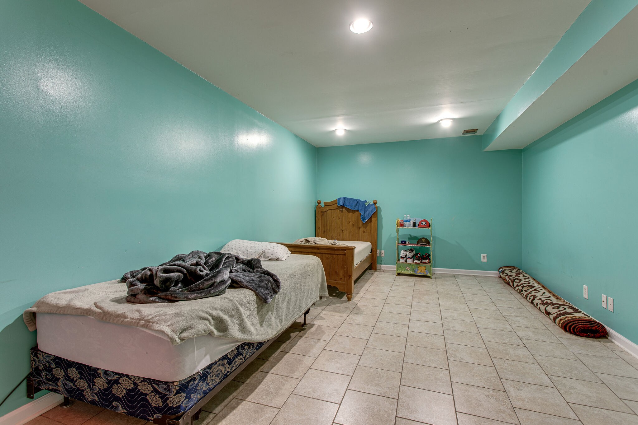 116 Tusculum Road Antioch, TN 37013 - Photo 22 of 27 a bed sitting in a bedroom next to a lamp