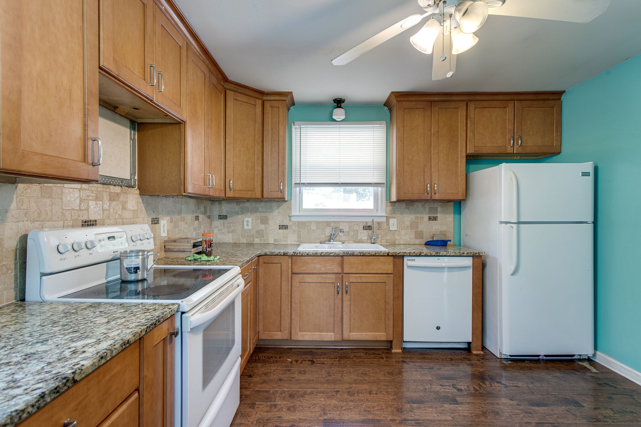 116 Tusculum Road Antioch, TN 37013 - Photo 8 of 27 a kitchen with a sink a refrigerator and cabinets