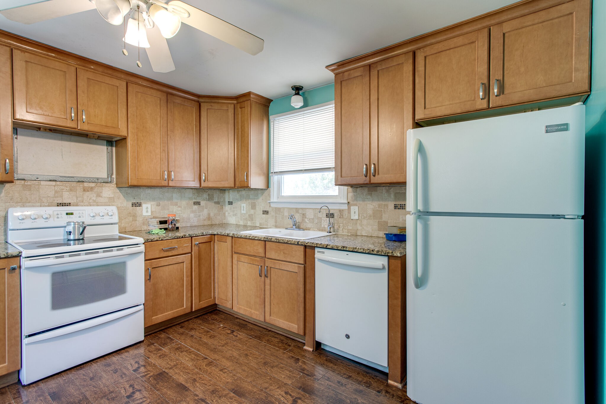 116 Tusculum Road Antioch, TN 37013 - Photo 9 of 27 a kitchen with stainless steel appliances granite countertop a refrigerator a stove a sink and a white cabinets