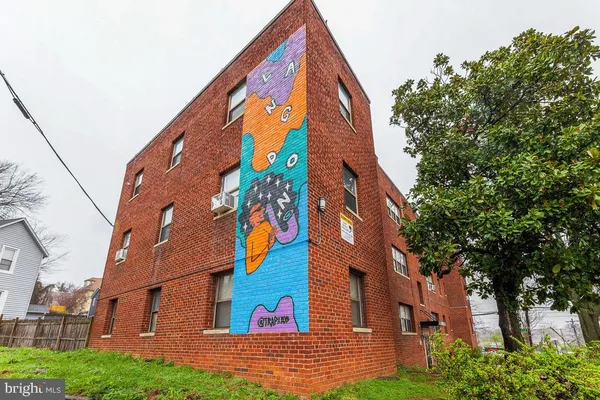 a view of a building with a tree