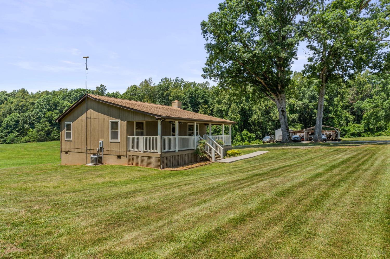 4466 Five Forks Road Pamplin, VA 23958 - Photo 22 of 34 a house view with a sitting space and garden