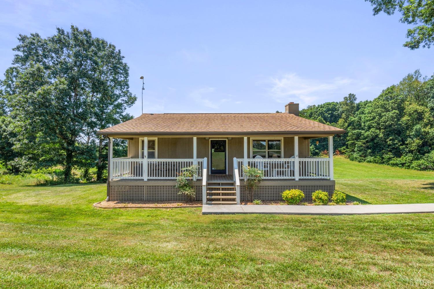 4466 Five Forks Road Pamplin, VA 23958 - Photo 24 of 34 a front view of a house with a garden