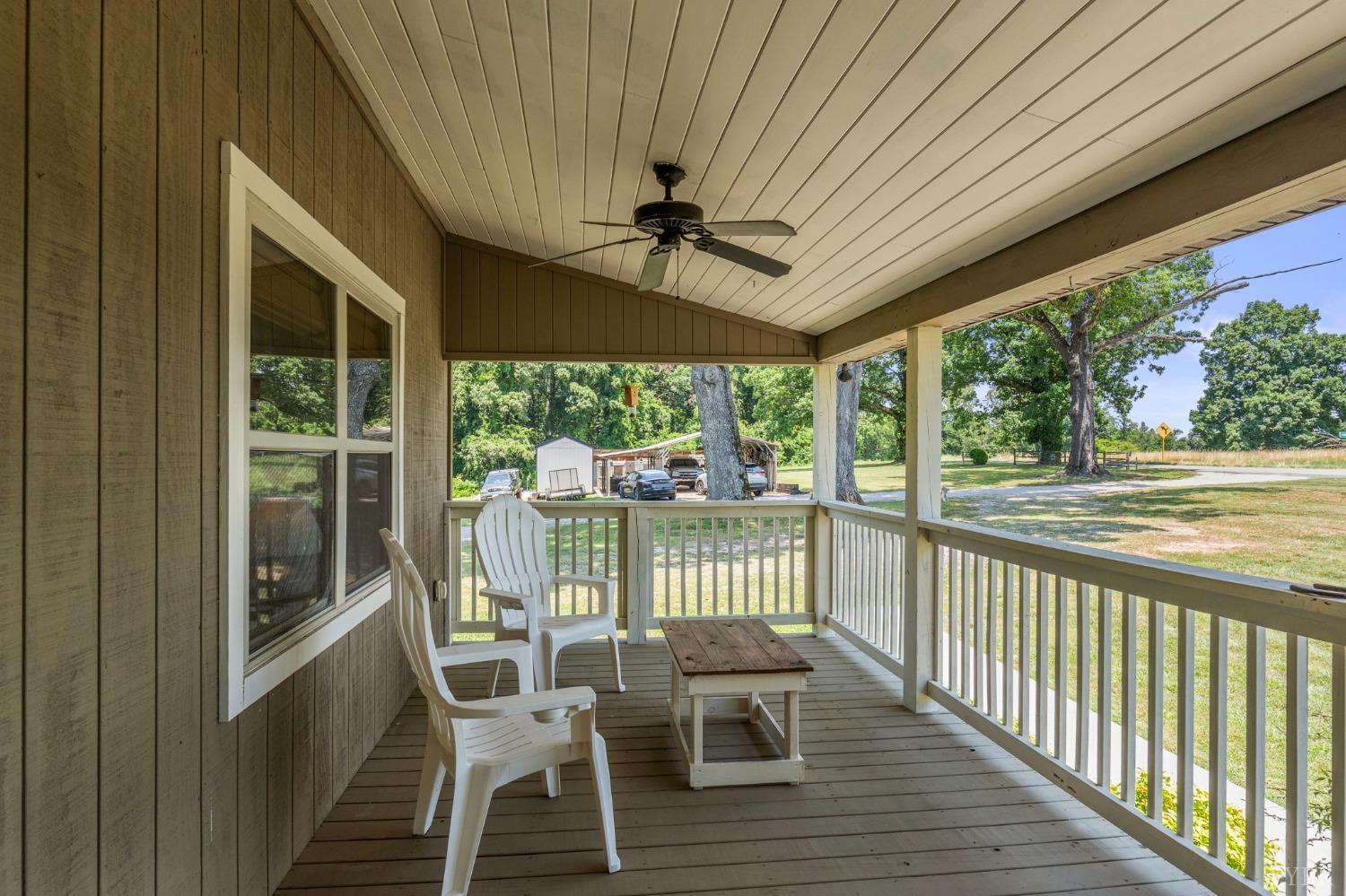 4466 Five Forks Road Pamplin, VA 23958 - Photo 25 of 34 a view of a chairs and table in patio with a large window
