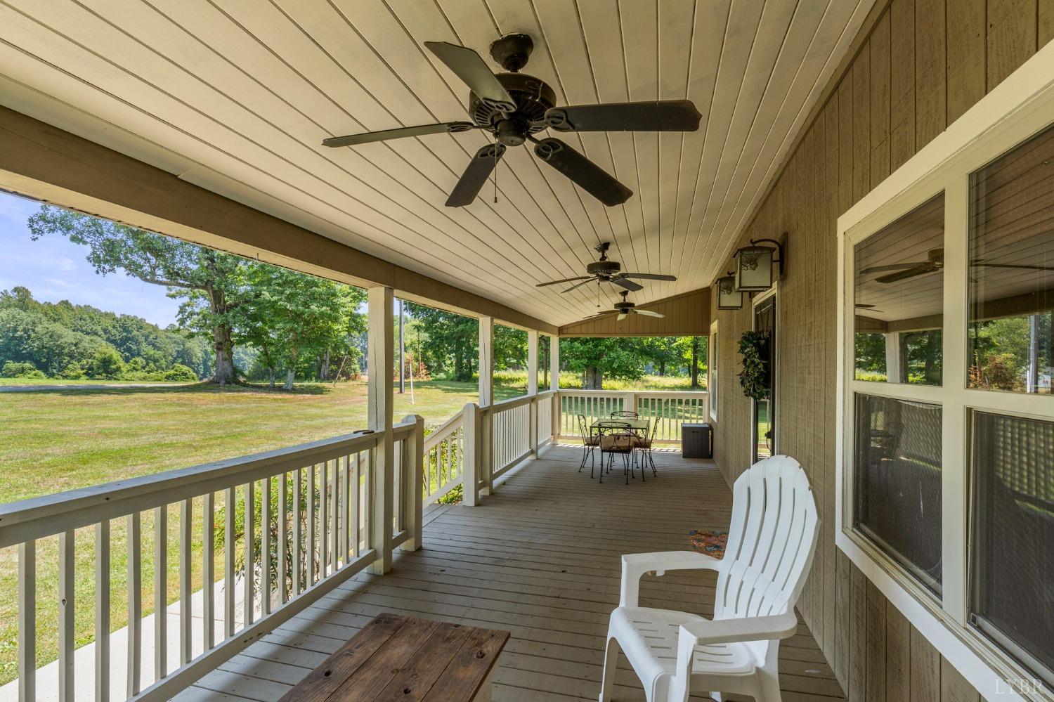 4466 Five Forks Road Pamplin, VA 23958 - Photo 26 of 34 a view of a porch with furniture and a yard