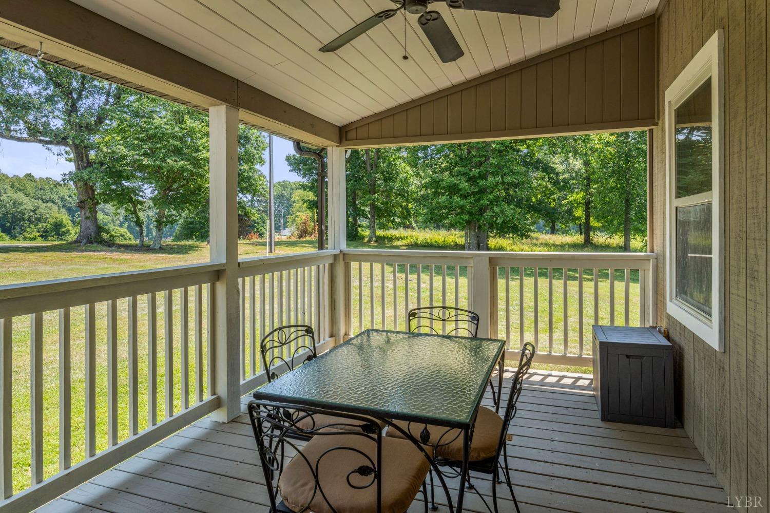 4466 Five Forks Road Pamplin, VA 23958 - Photo 28 of 34 a view of a balcony with table and chairs