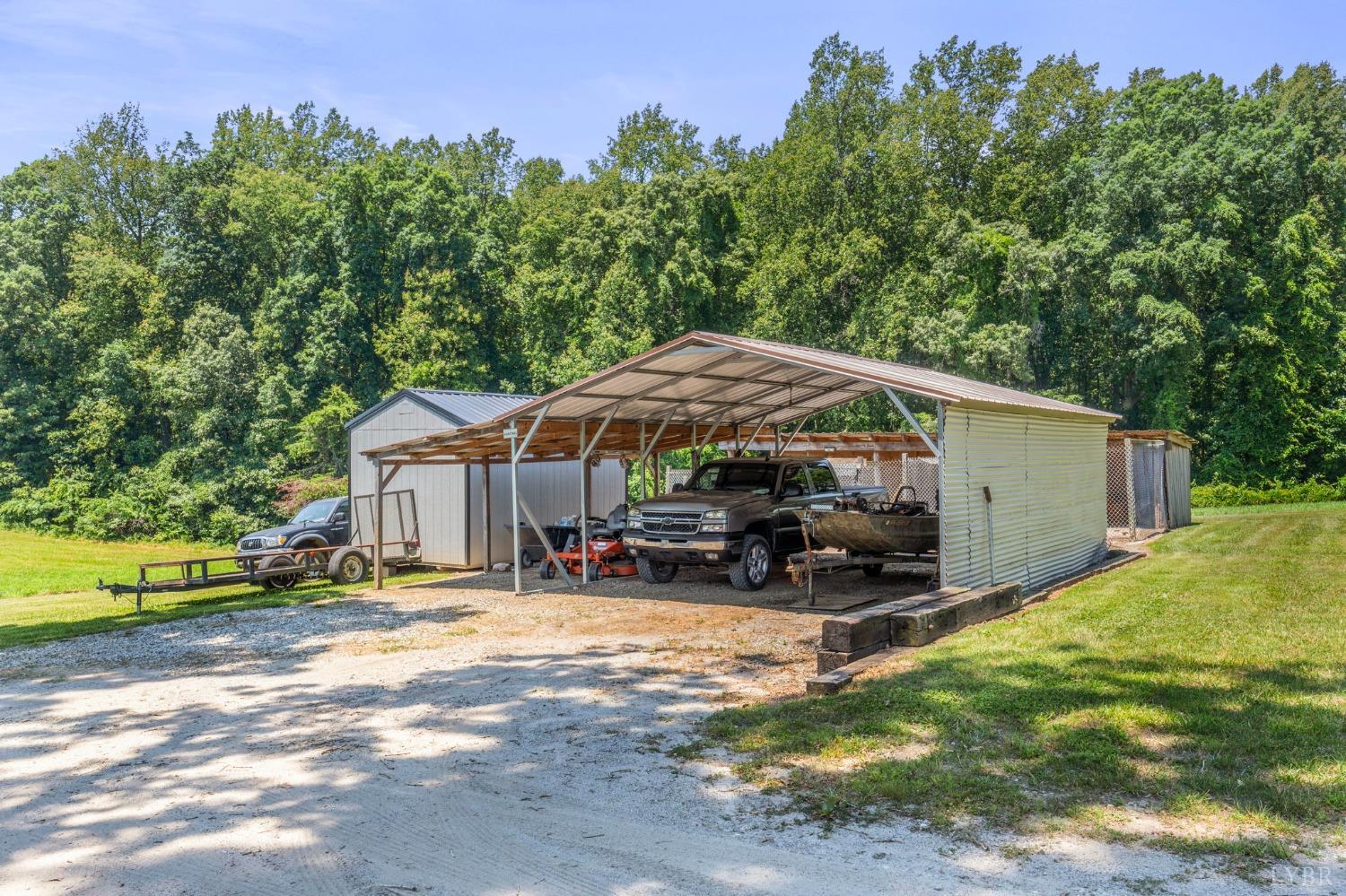 4466 Five Forks Road Pamplin, VA 23958 - Photo 30 of 34 a backyard of a house with yard and outdoor seating