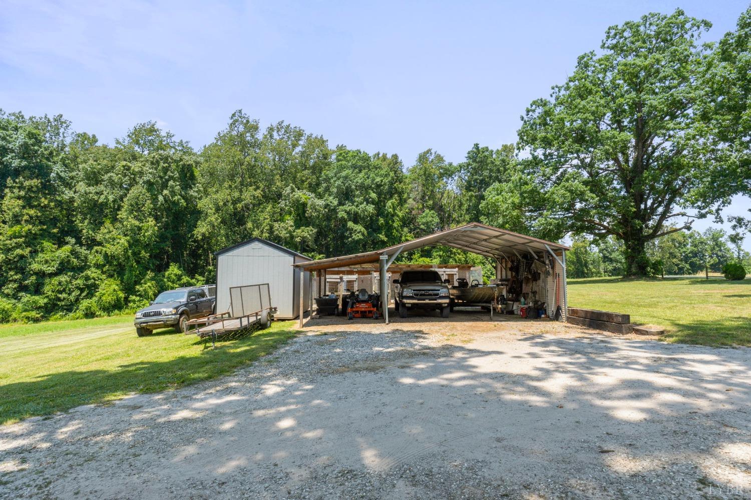 4466 Five Forks Road Pamplin, VA 23958 - Photo 33 of 34 a view of a house with backyard and trees
