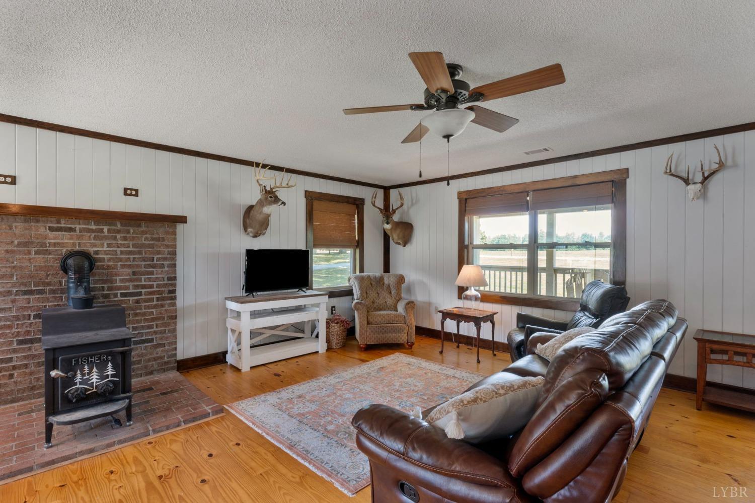 4466 Five Forks Road Pamplin, VA 23958 - Photo 5 of 34 a living room with furniture and a fireplace