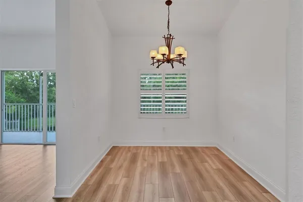 a view of an empty room and a window