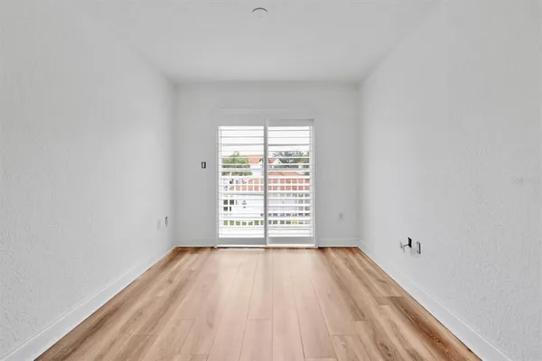 a view of a storage and utility room with closet